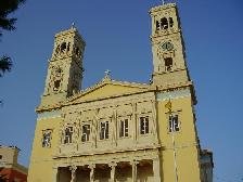 My friend Maxim admiring the town hall on Miaouli Square.