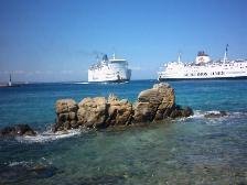 Ferries sailing into Mykonos harbour